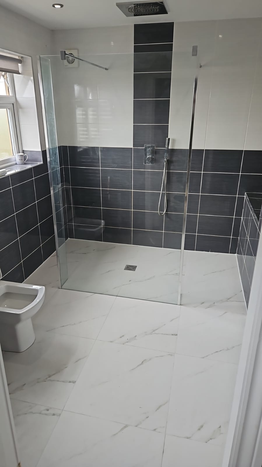 Marble-tiled walk-in wet room