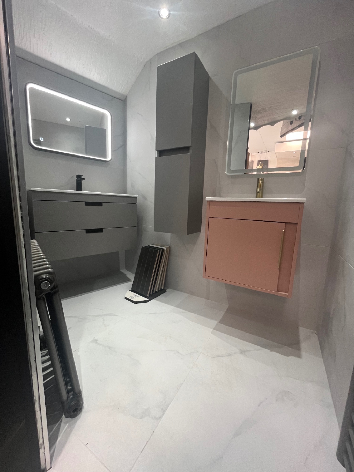 Grey and blush loft suite with backlit mirrors