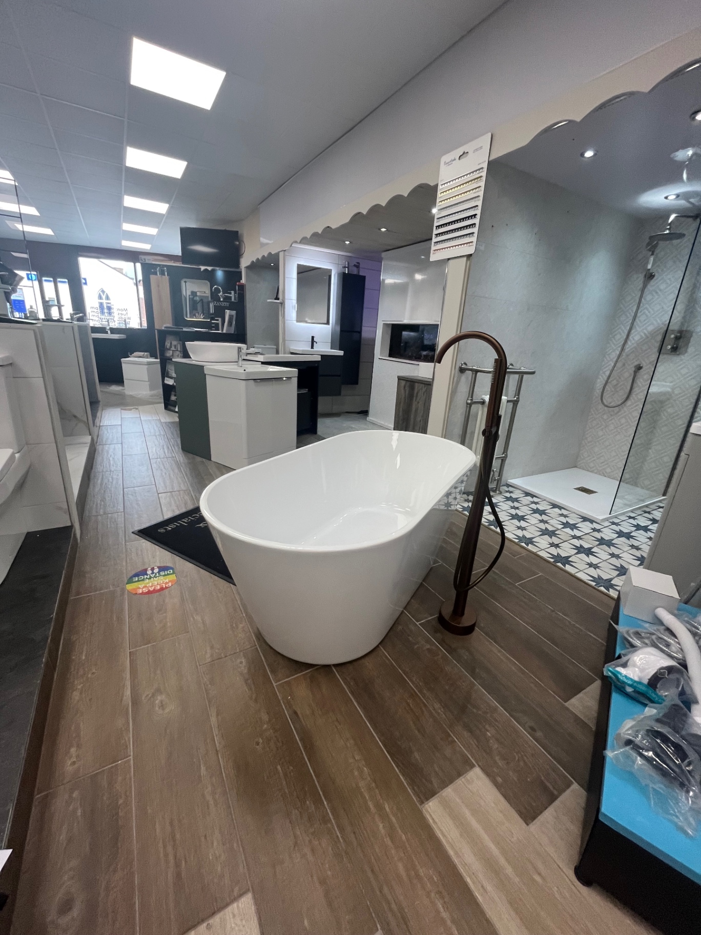 Freestanding tub in the main showroom aisle