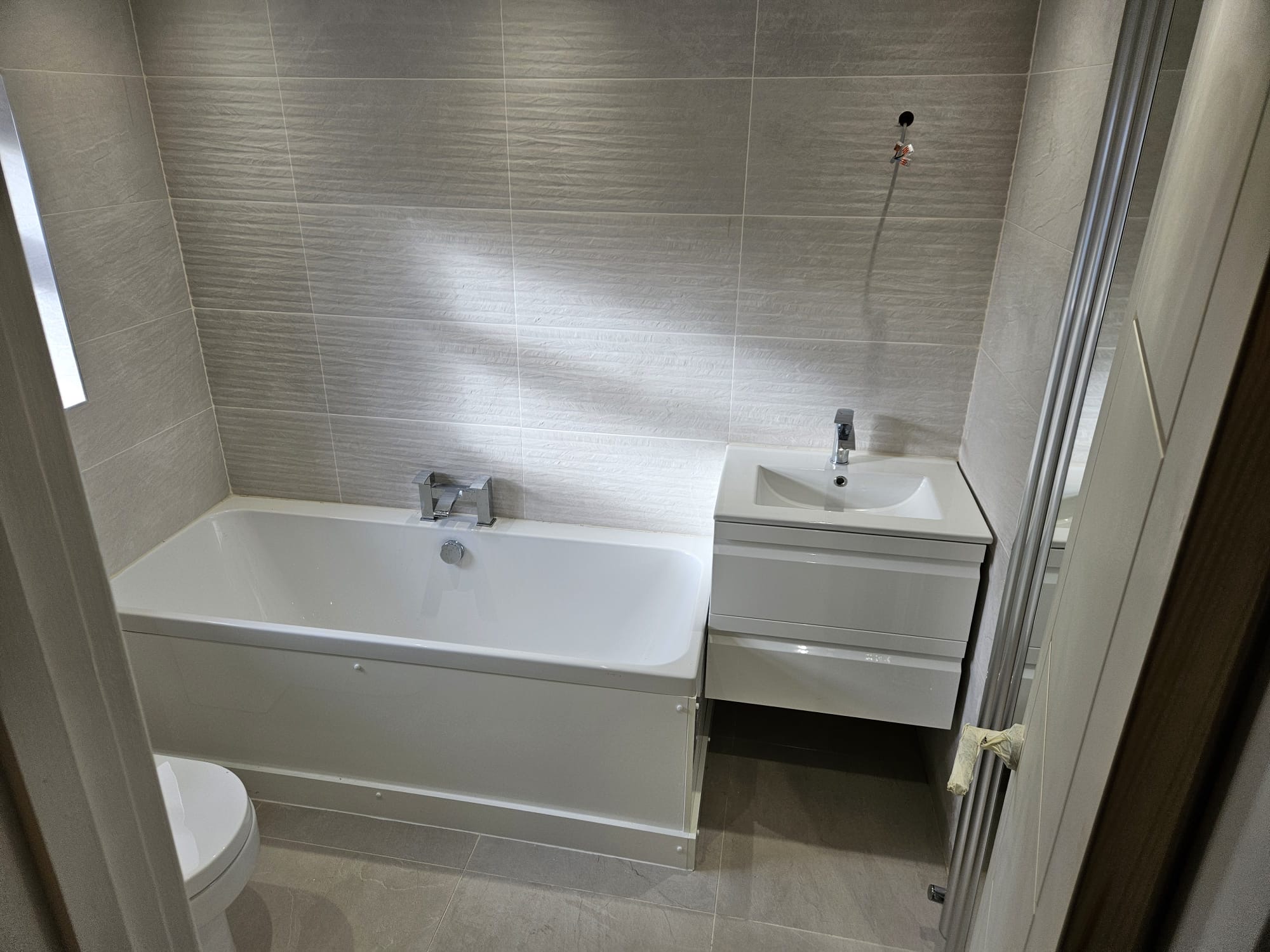 Clean white bath and vanity combo